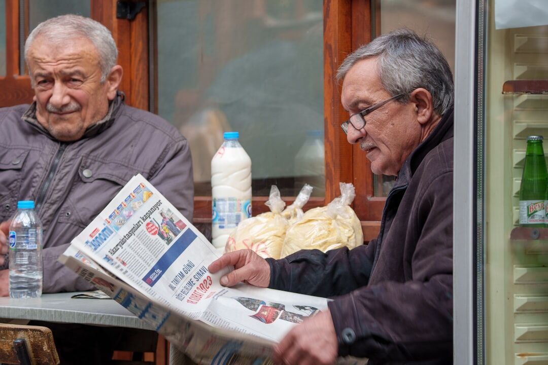 senior reading newspaper